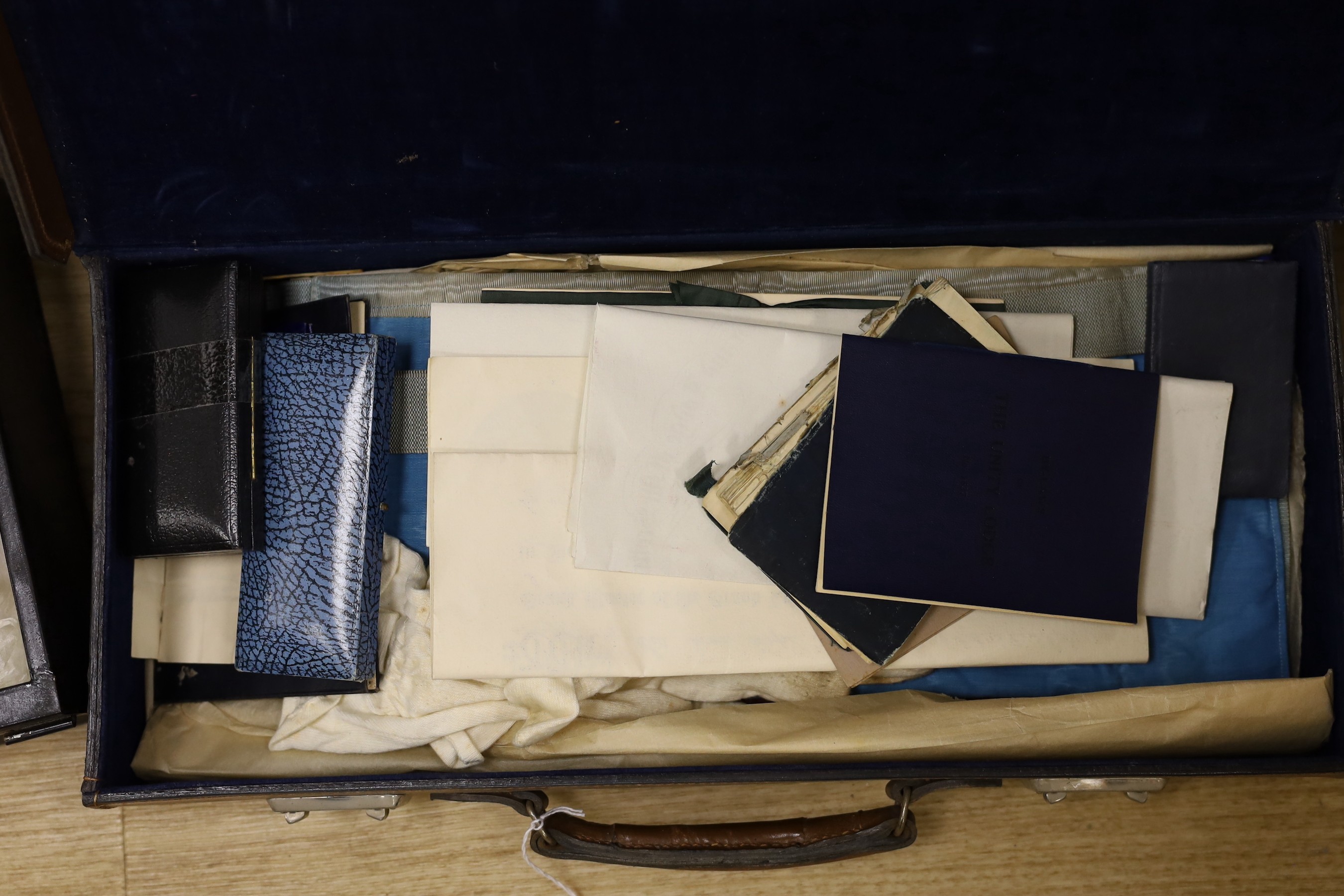A collection of Masonic medals, cuffs and ephemera and, a W Masjid-1, Suleman Lodge Banquet menu autographed on the front cover and Proceedings of The Grand Lodge Bombay 1939, together in two suitcases